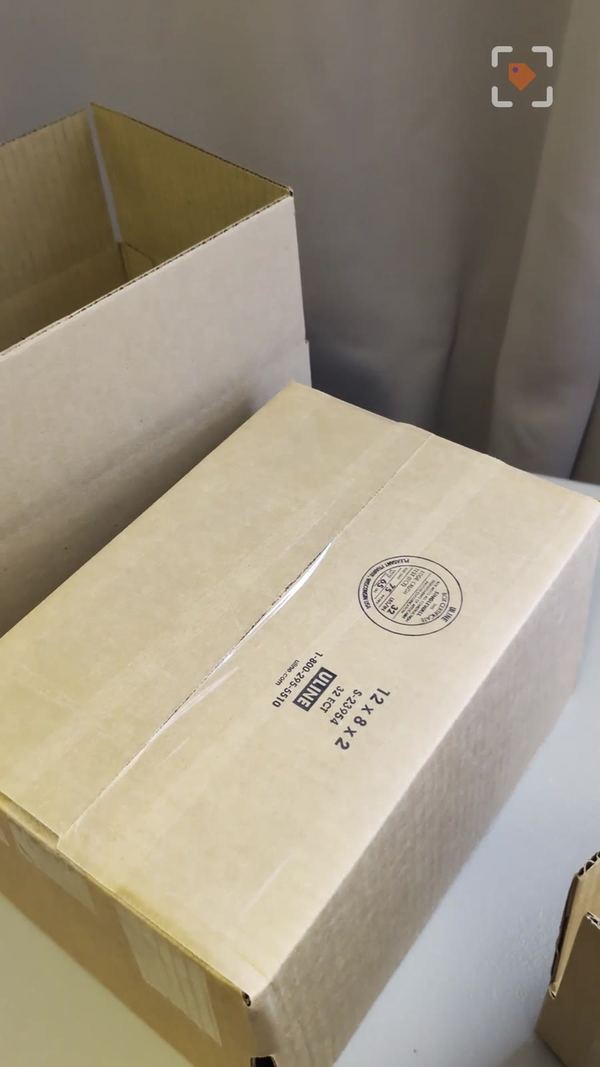 A taped 12x8x2 Uline shipping box